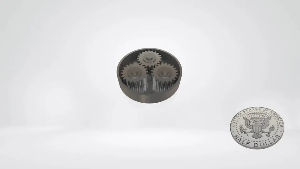 A small precision gear and a planetary gear assembly next to a US half dollar for scale